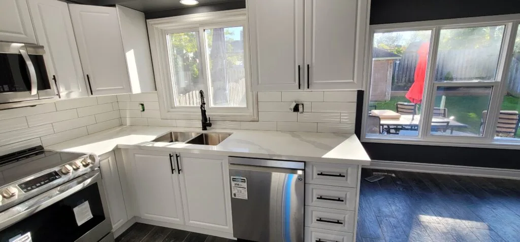 Kitchen renovation in Hamilton featuring custom cabinets and quartz countertops